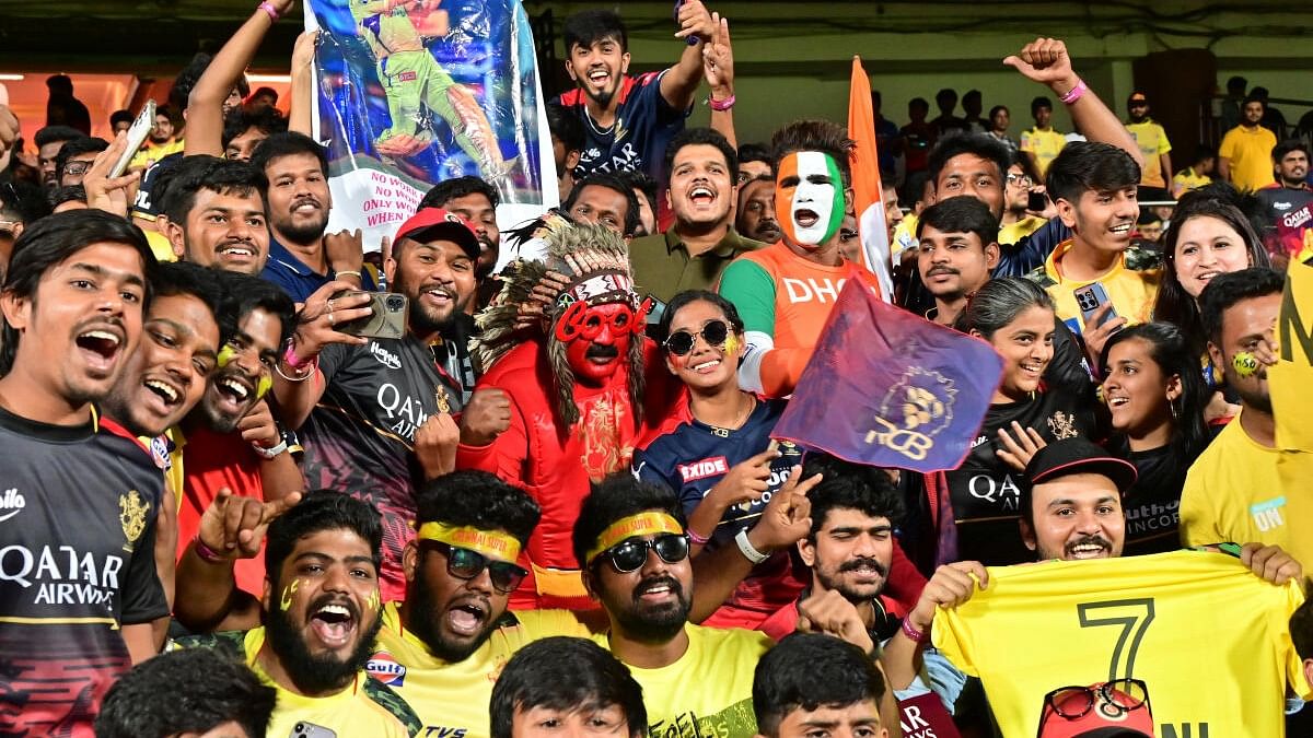 Fans root for their favourites during the IPL match in Bengaluru on Monday. Credit: DH PHOTO/PRASHANTH H G