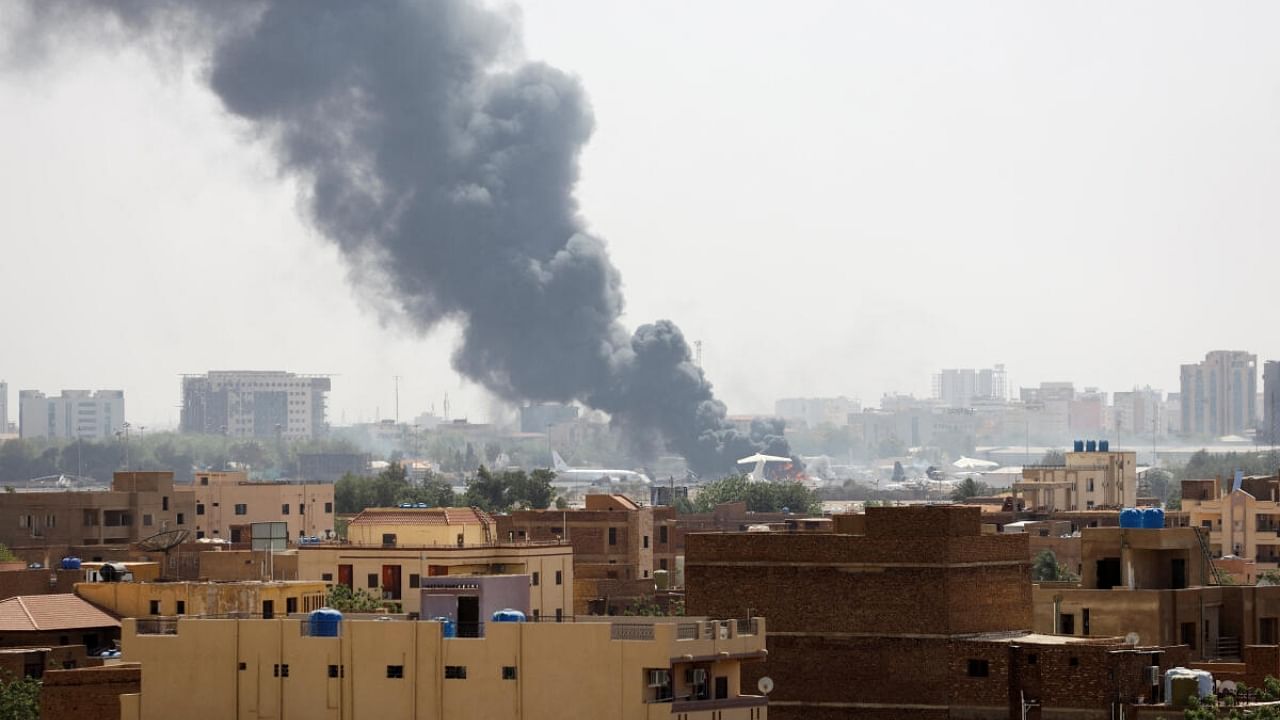 Smoke rises from burning aircraft inside Khartoum Airport during clashes between the paramilitary Rapid Support Forces and the army in Khartoum. Credit: Reuters Photo