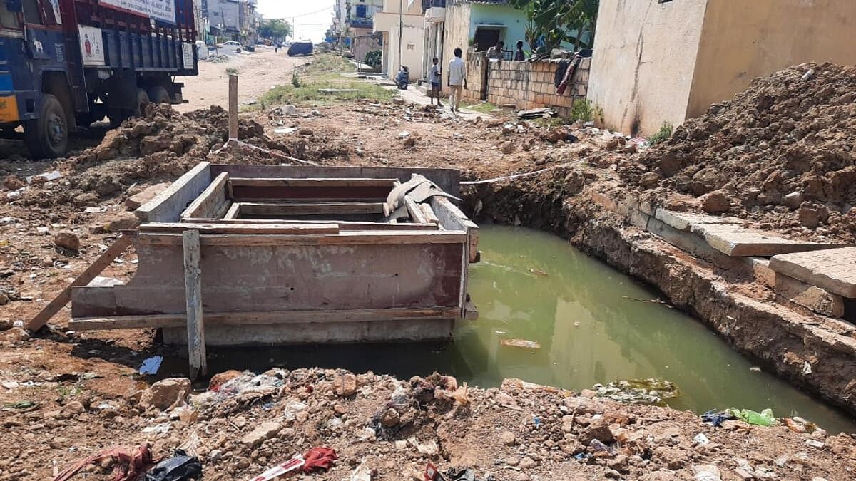 The 28-month-old boy had fallen into this pit dug up in front of his house at Magadi Road. Credit: Special Arrangement