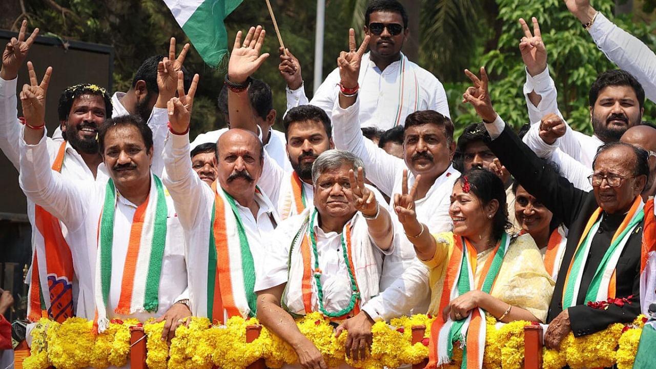 Congress leader Jagadish Shettar flashes victory sign during a rally after filing his nomination papers, ahead of the Karnataka Assembly elections, in Hubballi, Wednesday, April 19, 2023. Credit: PTI Photo