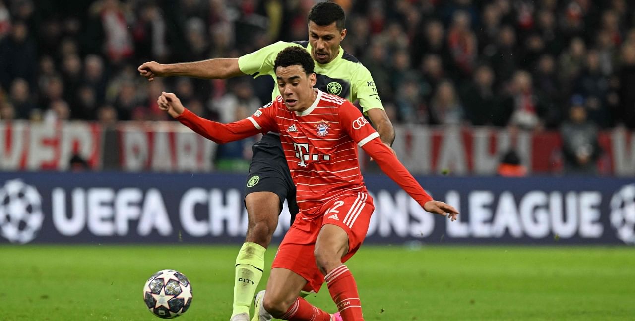 Bayern Munich's German midfielder Jamal Musiala (front) and Manchester City's Spanish midfielder Rodri vie for the ball during the UEFA Champions League quarter-final, second leg football match between Bayern Munich and Manchester City in Munich, southern Germany on April 19, 2023