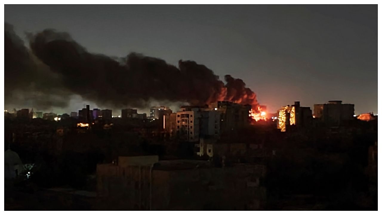 Smoke rises over the horizon as a fire burns after a strike in Khartoum, Sudan, Sunday, April 16, 2023. Credit: AP Photo