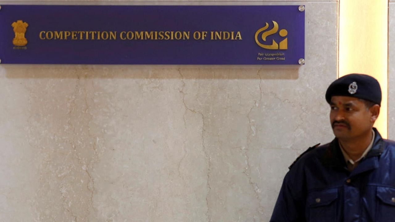 A security guard stands outside the Competition Commission of India (CCI) headquarters in New Delhi. Credit: Reuters Photo