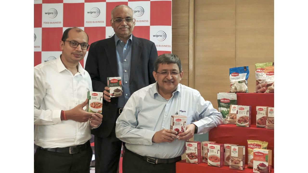 President of Food Business Anil Chugh, CEO Vineet Agrawal and CFO Sachin Bansal, of Wipro Consumer Care and lighting at the announcement of entering the food segmnet, with the acquisition of packaged food and spices brand Nirapara in Bengaluru on Monday. Credit: Special Arrangement