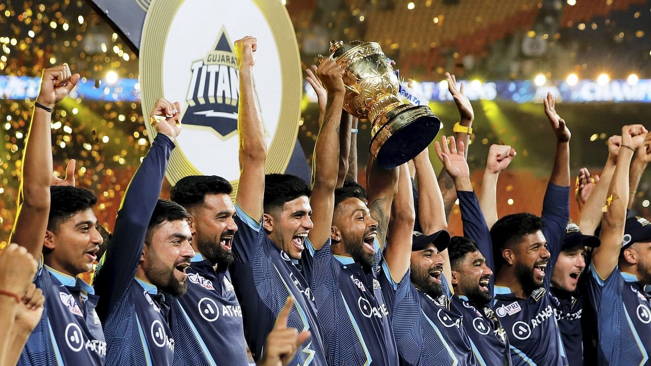 Gujarat Titans players with the IPL 2022 trophy. Credit: PTI Photo