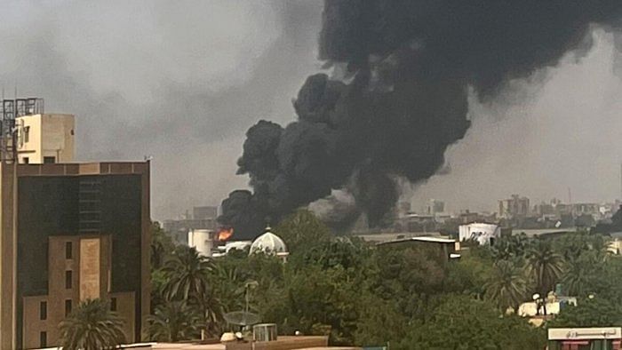 Smoke billows above residential buildings in Khartoum as fighting in Sudan raged for a second day in battles between rival generals. Credit: AFP Photo