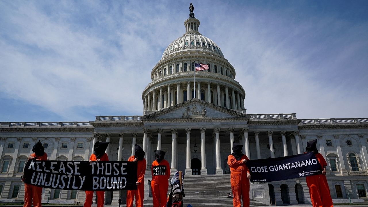 People in orange jumpsuits protest against the US prison at Guantanamo Bay, outside of the US Capitol in Washington. Credit: Reuters Photo