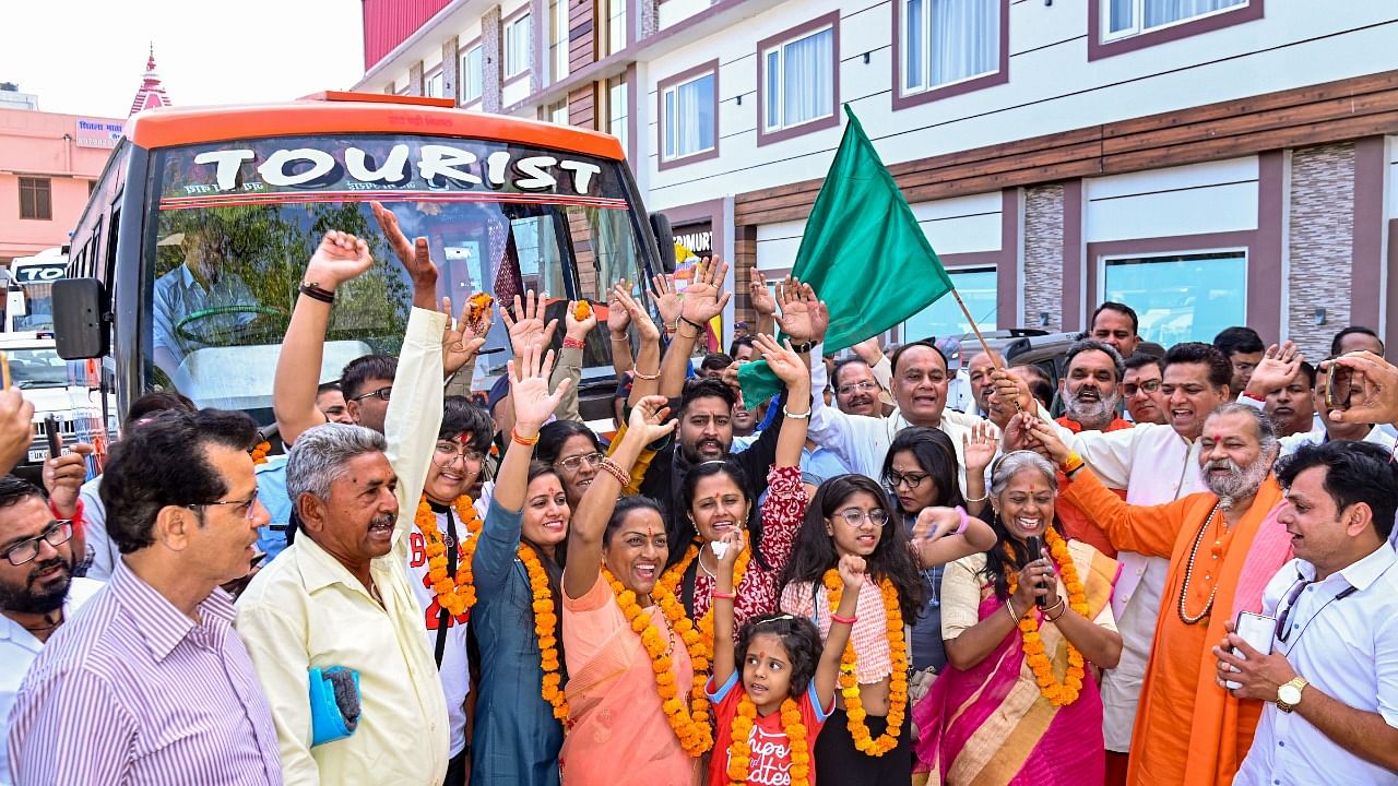 Devotees cheer before the start of the annual Char Dham Yatra. Credit: PTI Photo