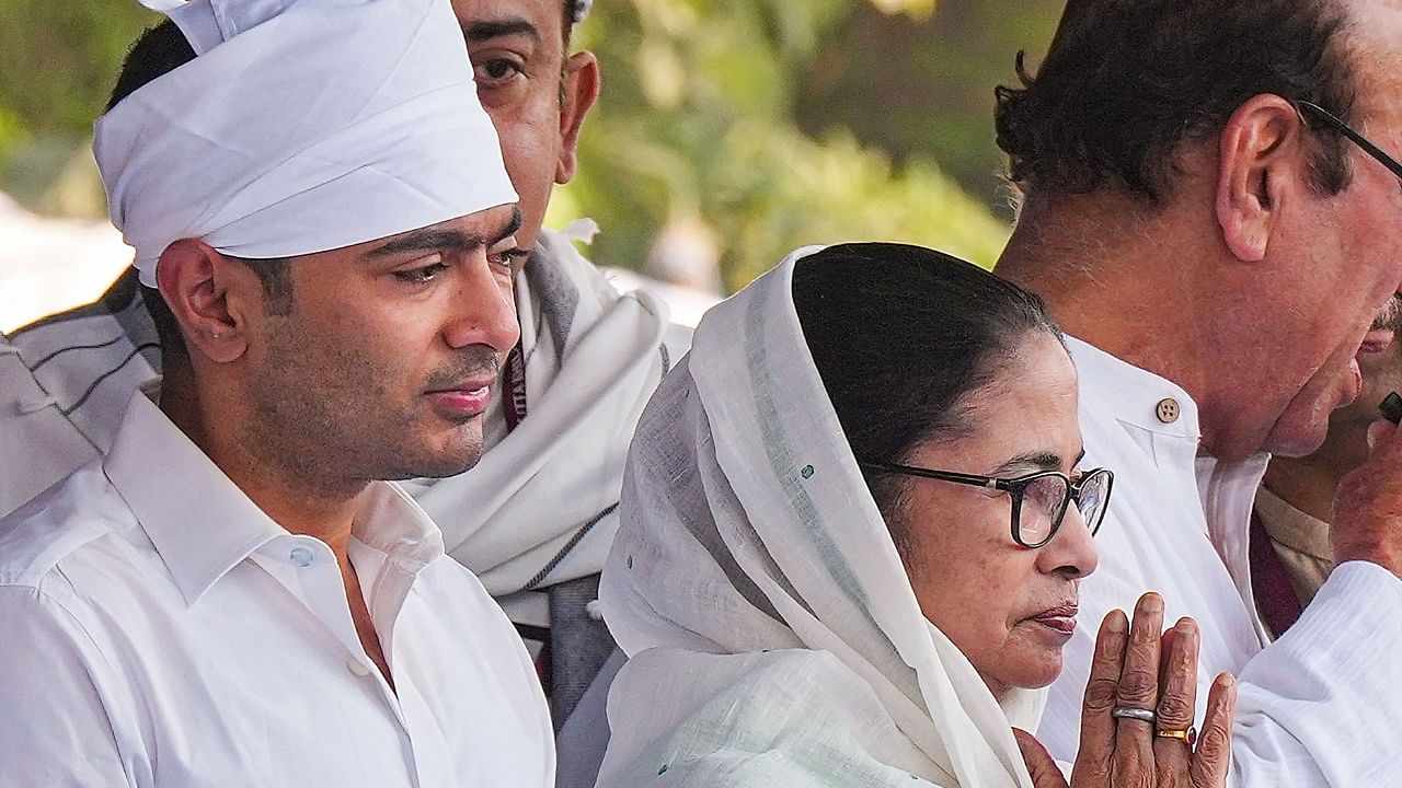 West Bengal Chief Minister Mamata Banerjee and her nephew and TMC National General Secretary Abhishek Banerjee greet muslims on the occason of Eid-al-Fitr, at Red Road. Credit: PTI Photo