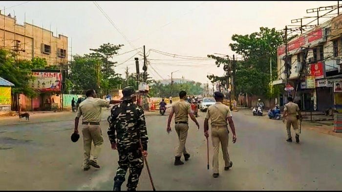 Security personnel during a curfew imposed after the incident of fresh violence on the occasion of Hanuman Jayanti, in Sambalpur. Credit: PTI Photo