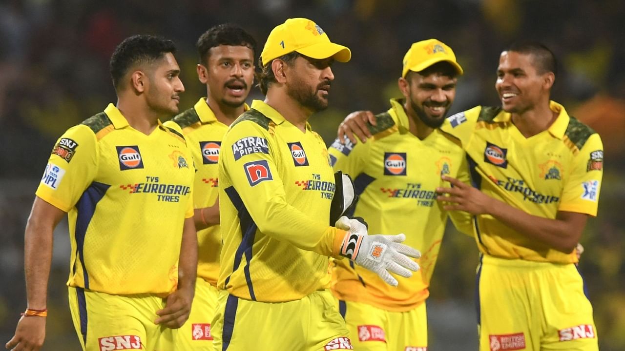 Chennai Super Kings' captain Mahendra Singh Dhoni along with his teammates walks back to the pavilion after winning the Indian Premier League Twenty20 cricket match between Kolkata Knight Riders and Chennai Super Kings. Credit: AFP Photo