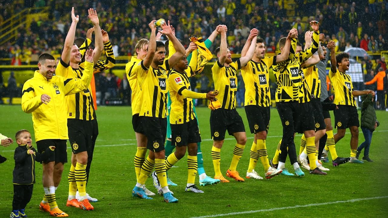 Borussia Dortmund players celebrate after the match. Credit: Reuters Photo