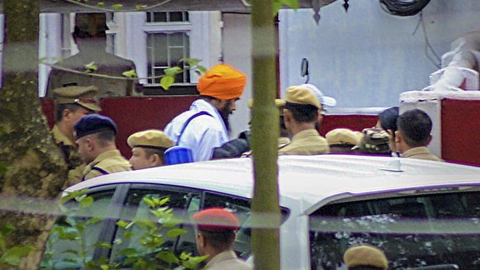 'Waris Punjab De' chief Amritpal Singh being brought to Dibrugarh Central Jail. Credit: PTI Photo