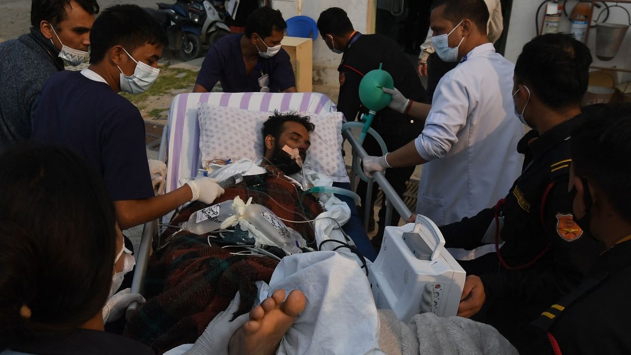 Medical staff and rescue personnel take Indian climber Anurag Maloo to a hospital after being airlifted, in Lalitpur on the outskirts of Kathmandu on April 20, 2023. Credit: AFP Photo