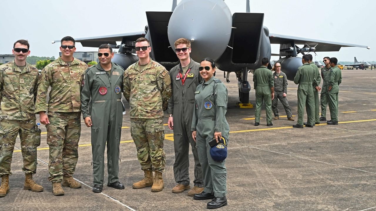 United States Air Force (USAF) and Indian Air Force (IAF) personnel pose in front of a F-15 Eagle fighter jet during the joint 'Exercise Cope India 2023' between the USAF and IAF at the air force station in Kalaikunda, in West Bengal, on April 24, 2023. Credit: AFP Photo