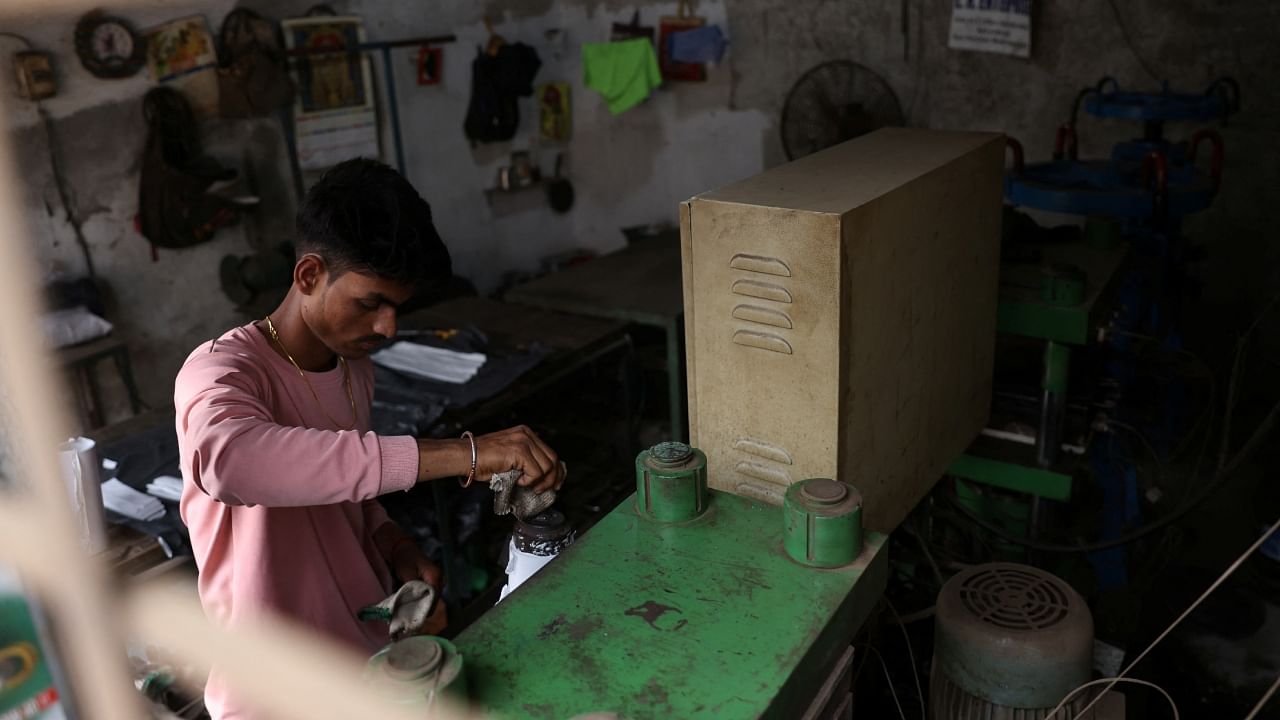 A 21-year-old aspiring college student and migrant worker Sujeet Kumar works at his brother-in-law Sunil Kumar's factory which manufactures rubber sealants for pressure cookers, on the outskirts of Mumbai. Credit: Reuters Photo