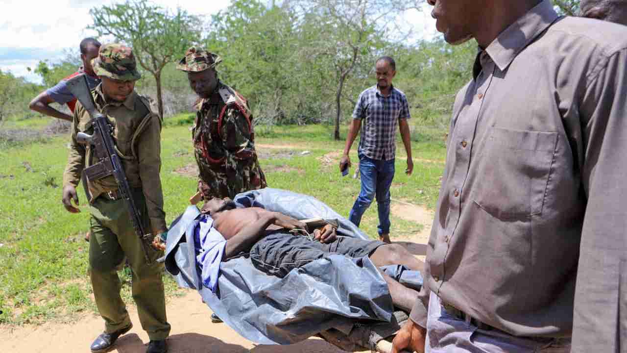 Kenya police officers and civilians rescue an emaciated member of a Christian cult named as Good News International Church, whose members believed they would go to heaven if they starved themselves to death, in Shakahola forest of Kilifi county, Kenya April 24, 2023. Credit: Reuters Photo