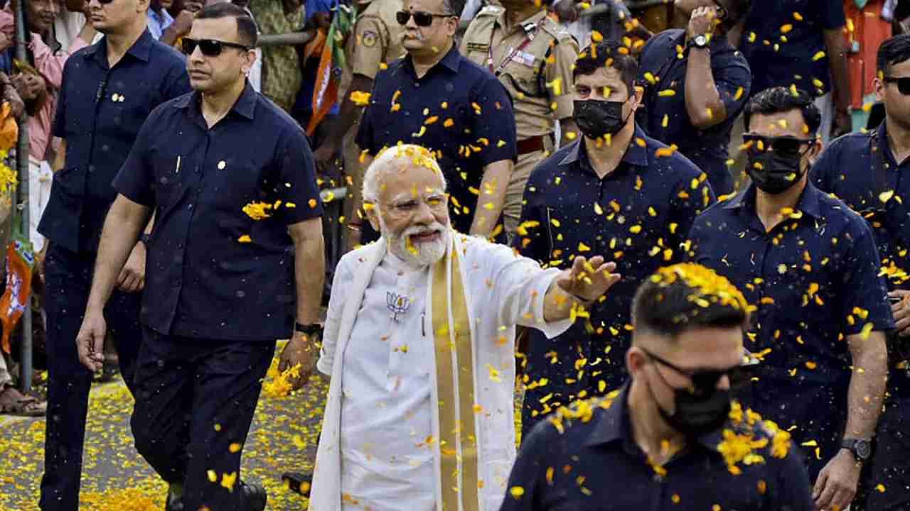 Prime Minister Narendra Modi waves at supporters during a roadshow, in Kochi, Monday, April 24, 2023.Credit: PTI Photo