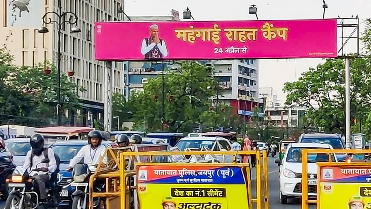 A poster of Rajasthan government's 'Mehngai Rahat Camp' with an image of Chief Minister Ashok Gehlot, in Jaipur. Credit: PTI Photo