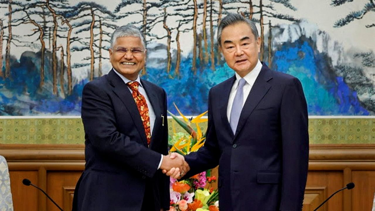 Indian Ambassador to China Pradeep Kumar Rawat with former Chinese Foreign Minister Wang Yi, June 2022. Credit: PTI File Photo