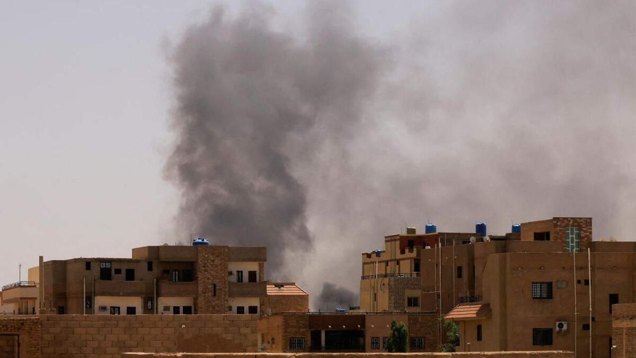 Smoke is seen rise from buildings during clashes between the paramilitary Rapid Support Forces and the army in Khartoum North, Sudan. Credit: Reuters Photo