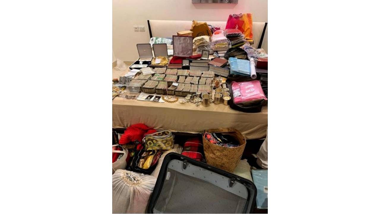Cash, gold and other items seized during the raid. Credit: Special Arrangement 