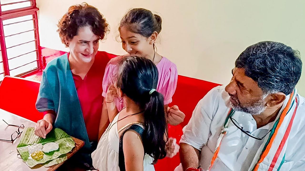 AICC General Secretary Priyanka Gandhi Vadra interacts with children at a dosa shop during her visit to the poll-bound Karnataka, in Mysore district, Wednesday, April 26, 2023. Credit: PTI Photo