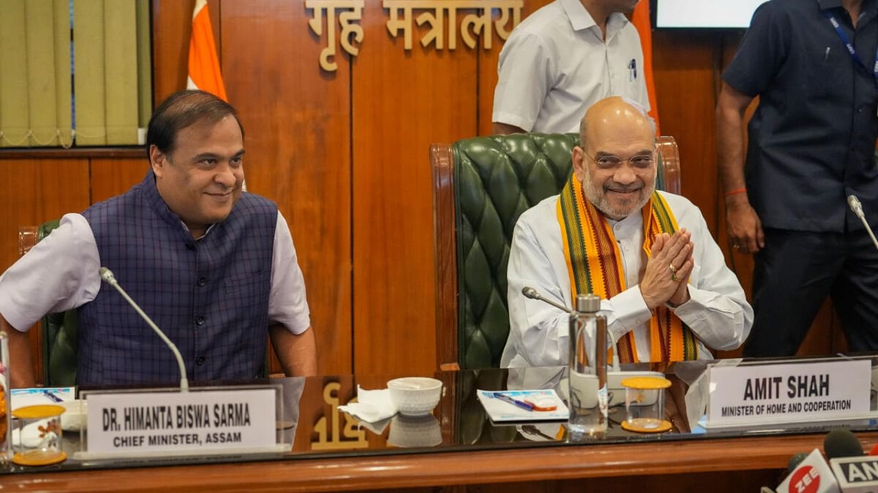 Union Minister for Home Affairs and Cooperation Amit Shah and Assam Chief Minister Himanta Biswa Sarma during the signing of a Memorandum of Understanding (MoU) between Dimasa National Liberation Army (DNLA) and the Government of Assam, in New Delhi, Thursday, April 27, 2023. Credit: PTI Photo