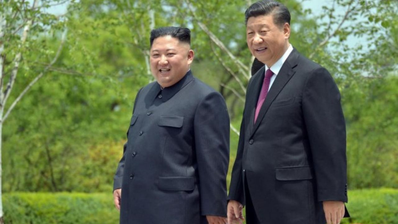 Kim Jong-Un (left) and Xi Jinping. Credit: Reuters File Photo