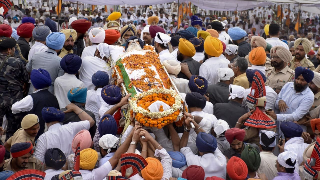 Family members and relatives during funeral of former Punjab chief minister and Shiromani Akali Dal patron Parkash Singh Badal, at Badal village in Sri Muktsar Sahib district, Thursday, April 27, 2023. Credit: PTI Photo
