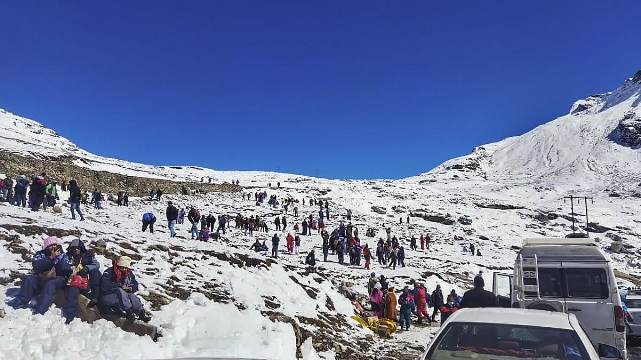 Tourists at snow-covered Rohtang Pass. Credit: PTI Photo