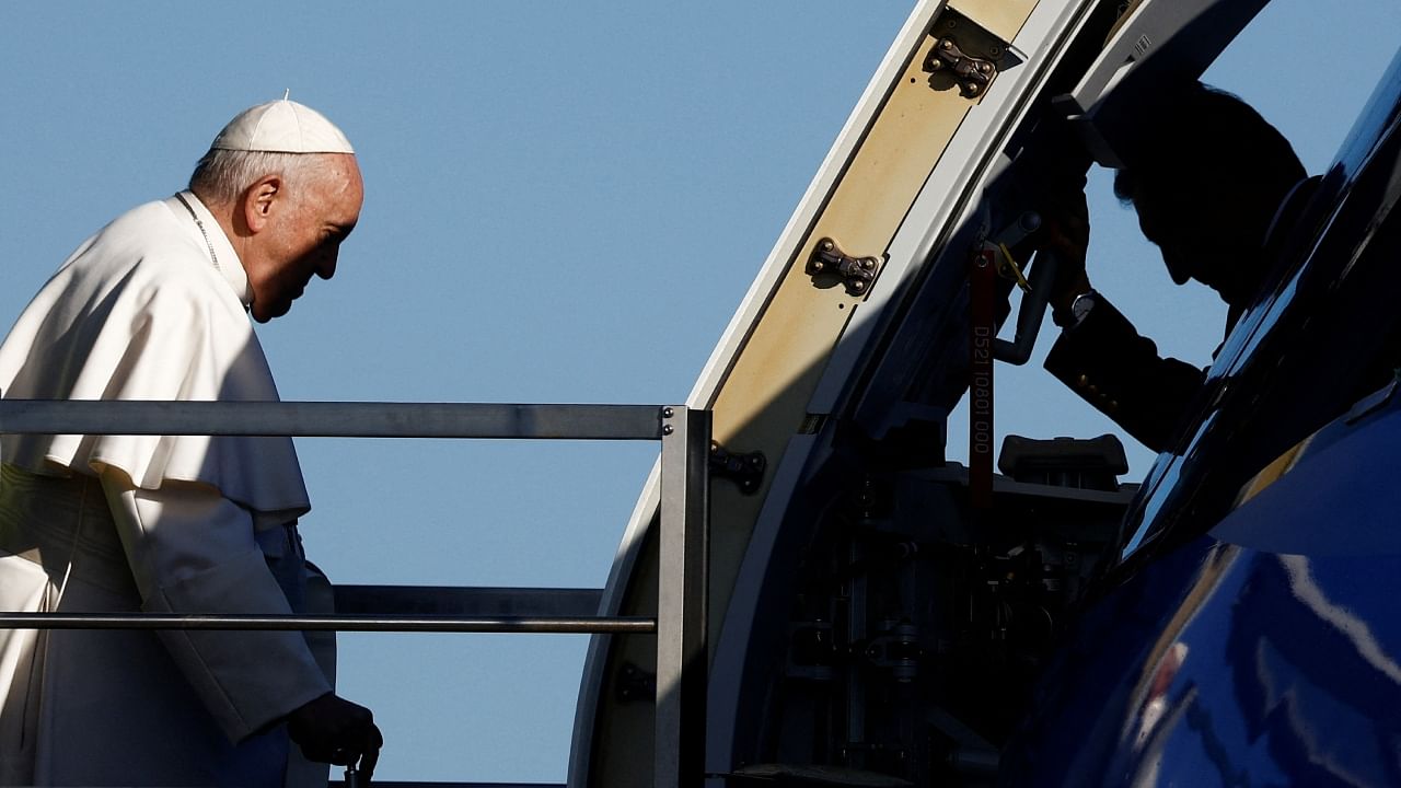Pope Francis boards the papal plane ahead of his apostolic visit to Hungary at Fiumicino airport in Rome, Italy, April 28, 2023. Credit: Reuters Photo
