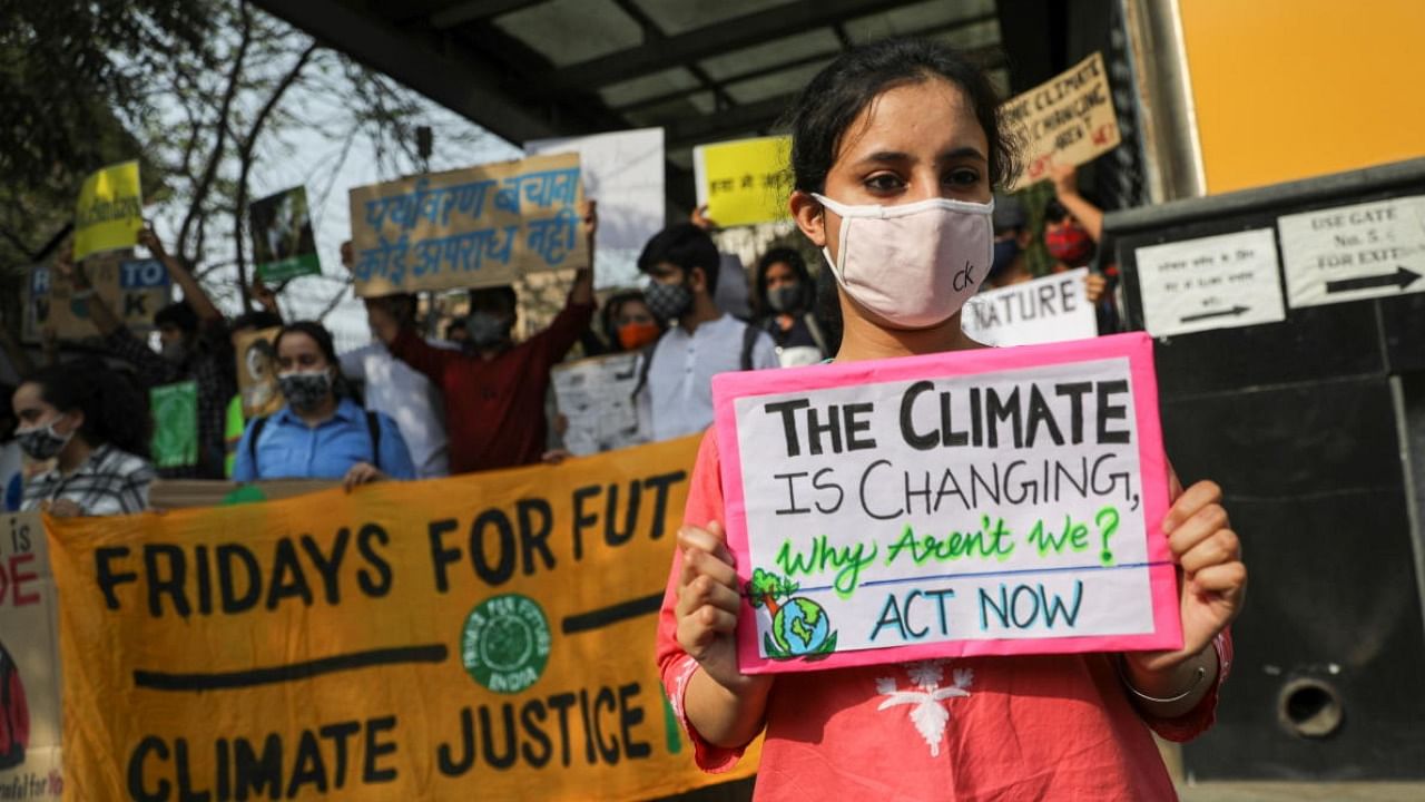 File photo of climate activists at a protest. Credit: PTI 