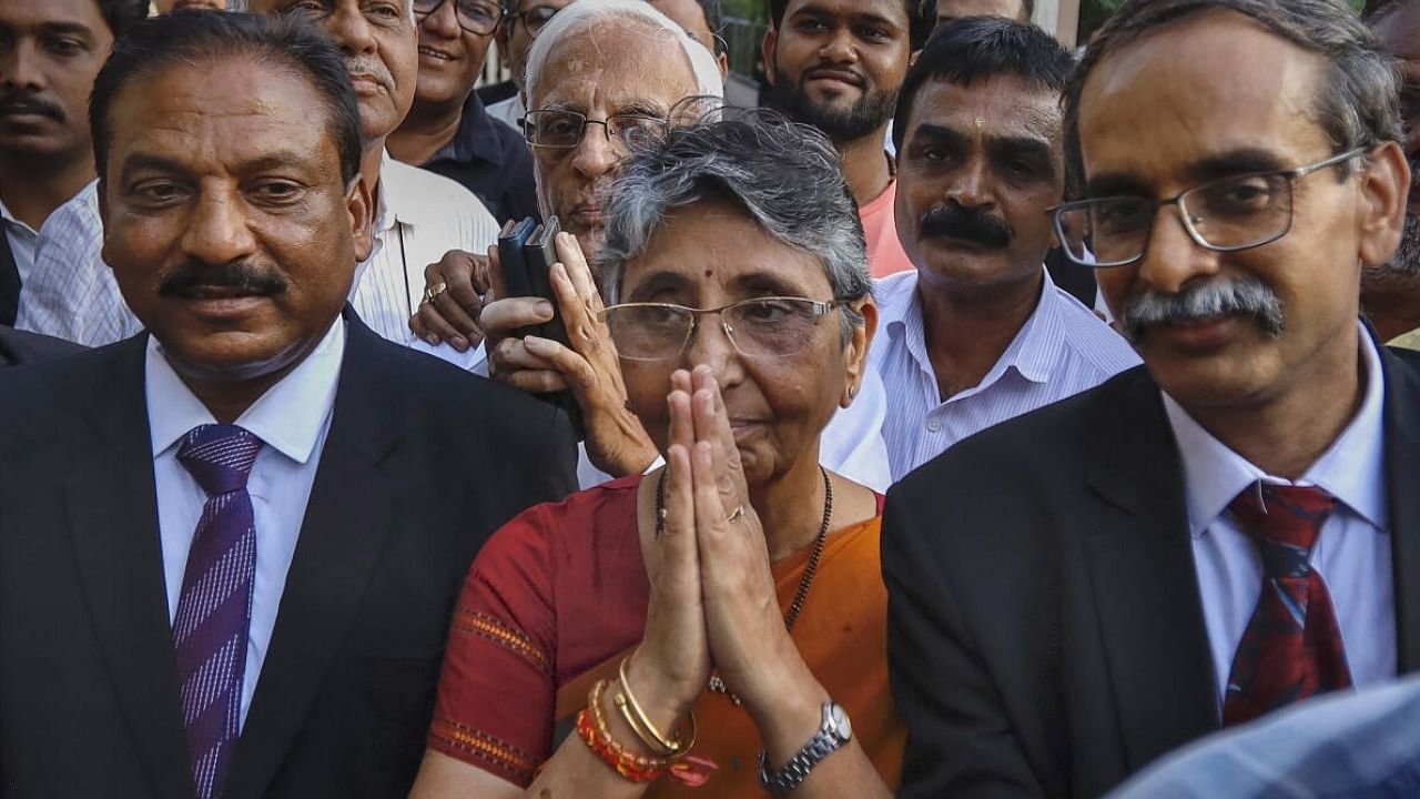  Ex-MLA Maya Kodnani along with advocates comes out of the Sessions Court after the verdict on Naroda Gam massacre case, in Ahmedabad credit: PTI Photo