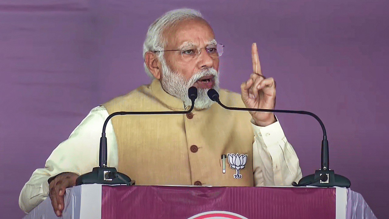 Prime Minister Narendra Modi speaks during a public meeting ahead of the Karnataka Assembly elections. Credit: PTI Photo