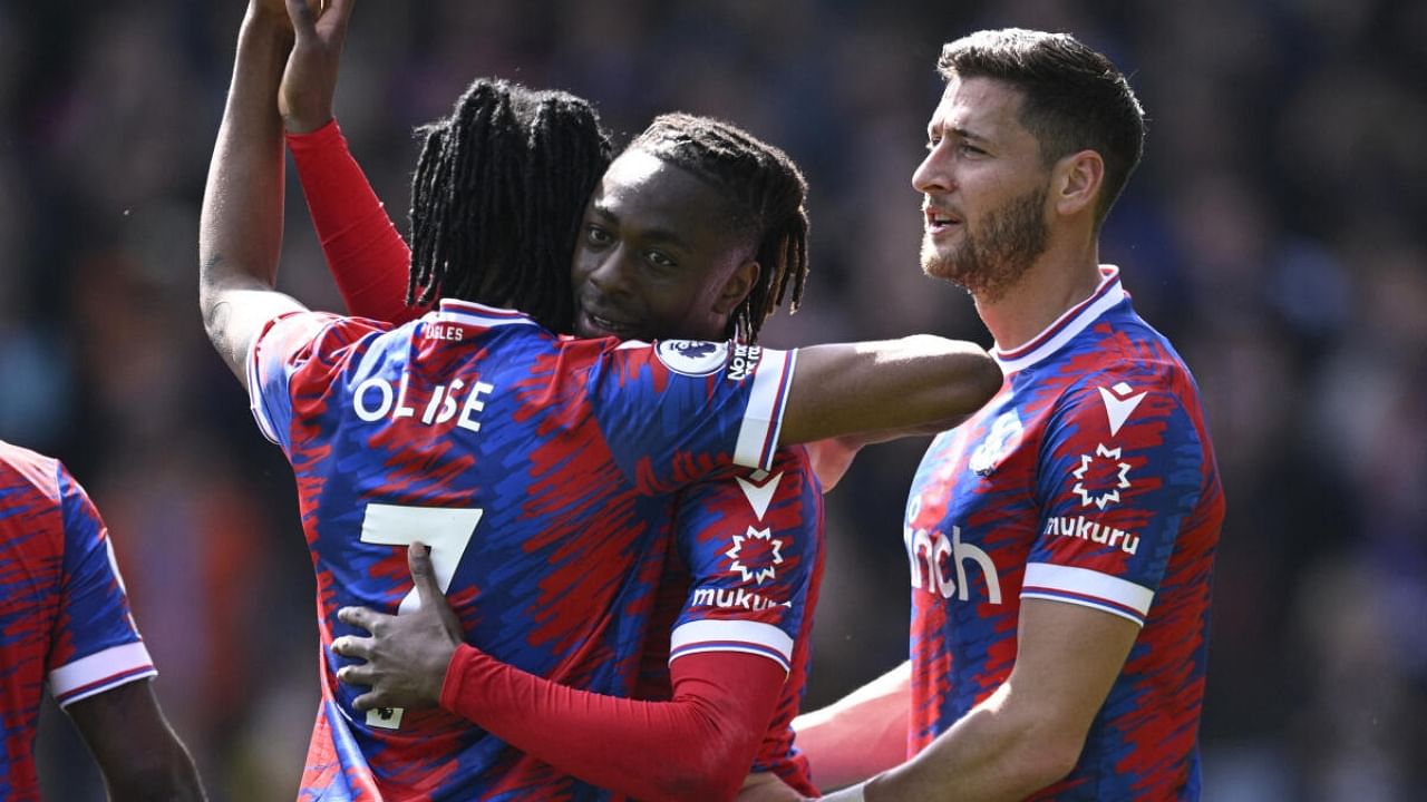 Crystal Palace's Eberechi Eze celebrates scoring their fourth goal with Michael Olise and Joel Ward. Credit: Reuters Photo