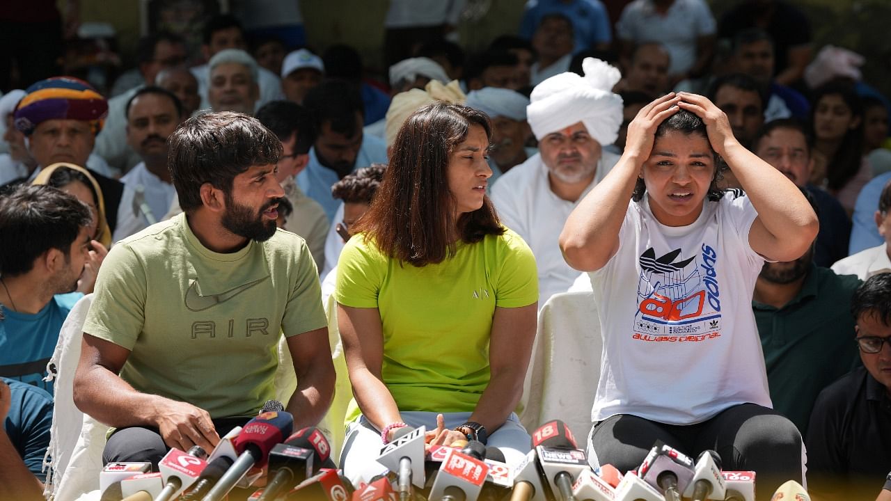 Wrestlers Bajrang Punia, Vinesh Phogat and Sakshi Malik at a press conference during their protest at Jantar Mantar. Credit: PTI Photo