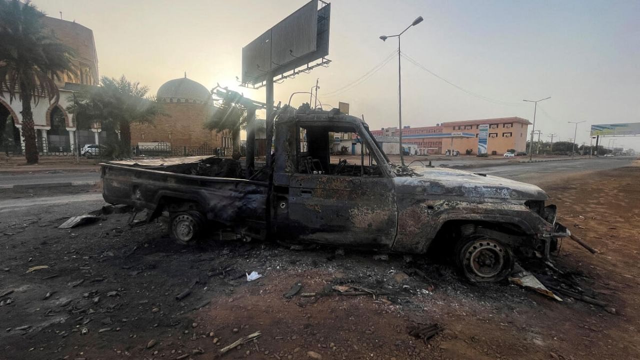 A burned vehicle is seen in Khartoum, Sudan. Credit: Reuters File Photo