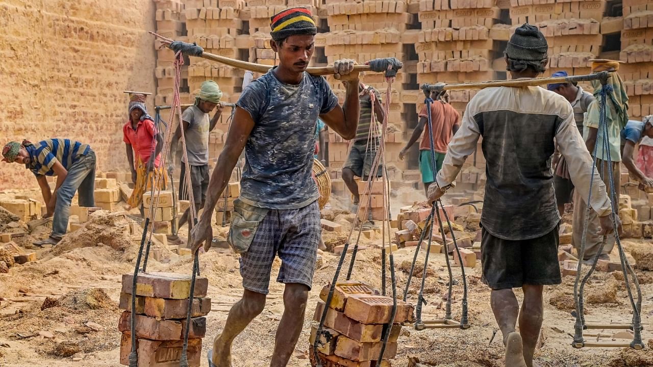 Labourers work at a brick factory on the occasion of Labour Day, in Nadia, West Bengal, May 1, 2023. Labour Day is often a privilege enjoyed only by organized labour. Credit: PTI Photo