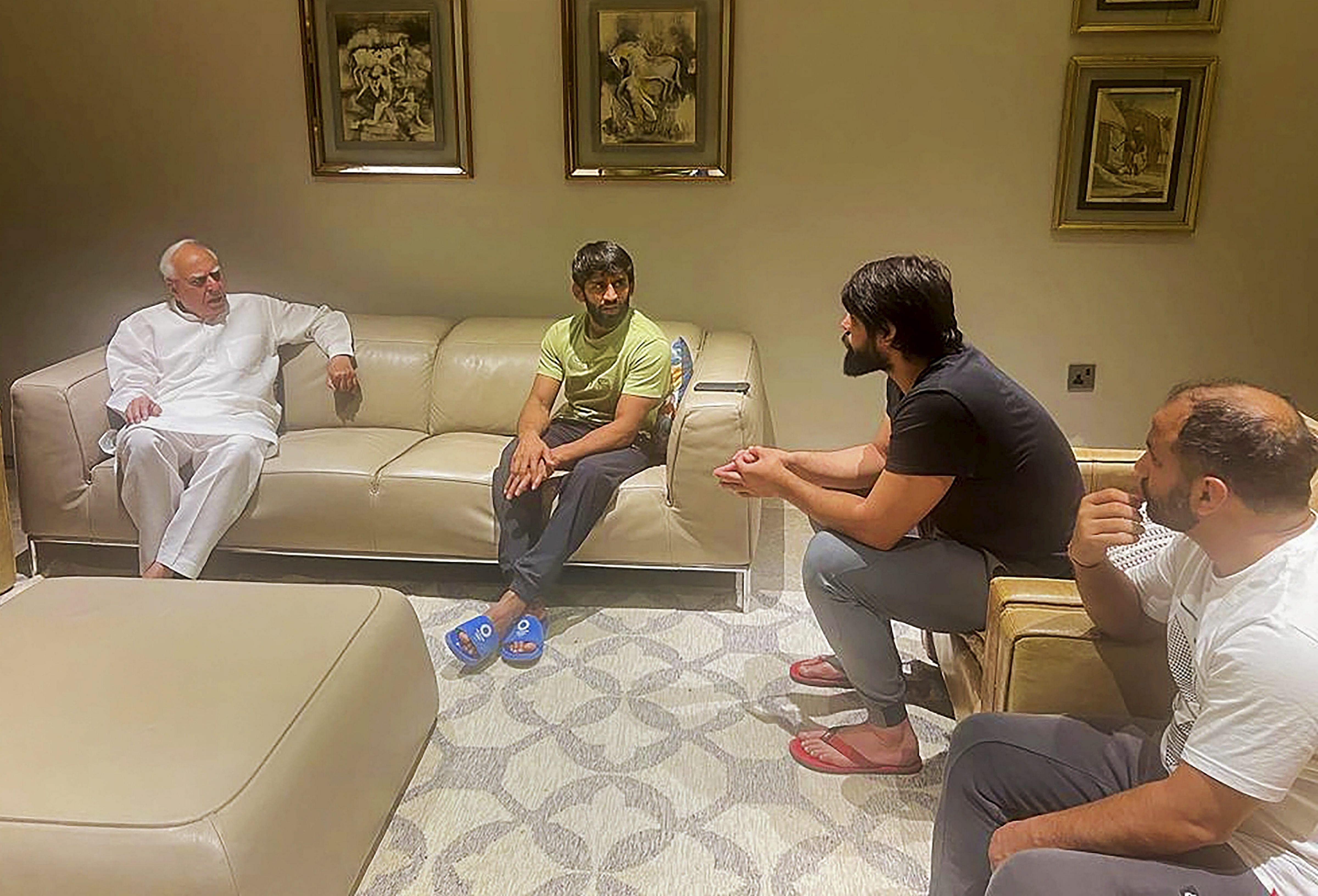 Wrestlers meets Rajya Sabha MP and eminent lawyer Kapil Sibal at his residence in New Delhi, Tuesday, April 25, 2023. Credit: PTI Photo