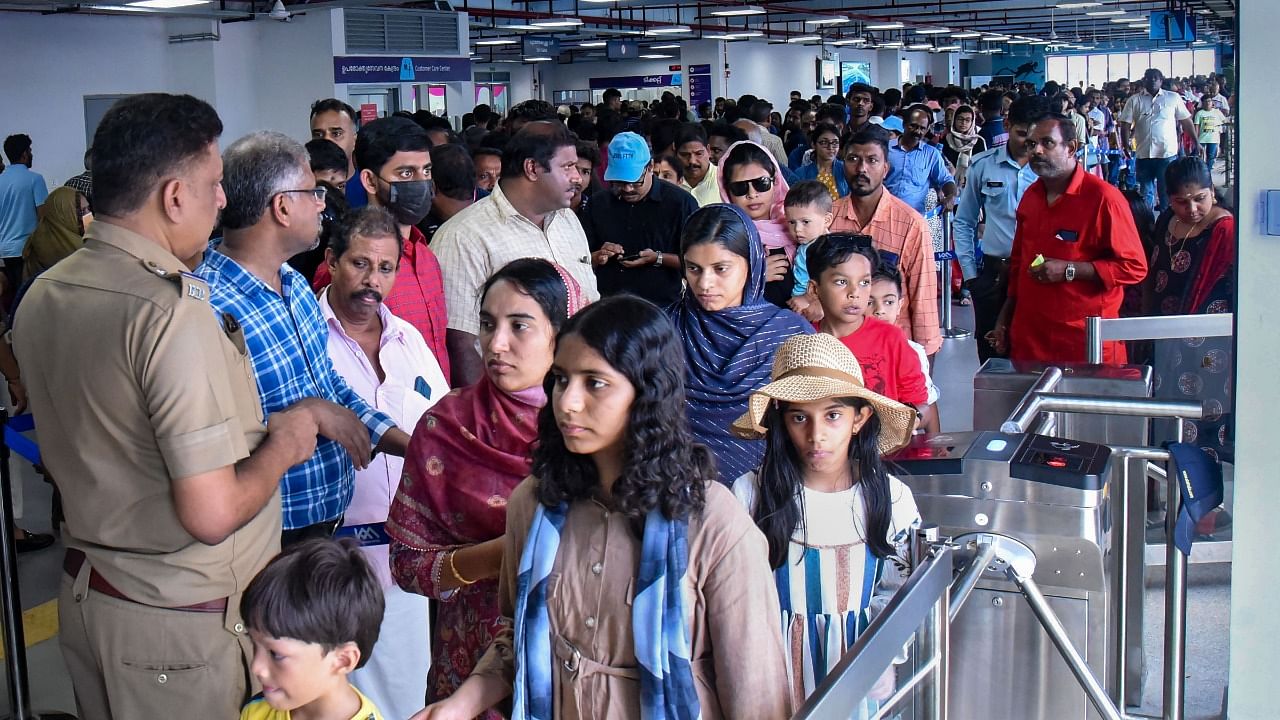 Commuters wait in queues to travel through India's first water metro, which was recently inaugurated by Prime Minister Narendra Modi, in Kochi. Credit: PTI Photo