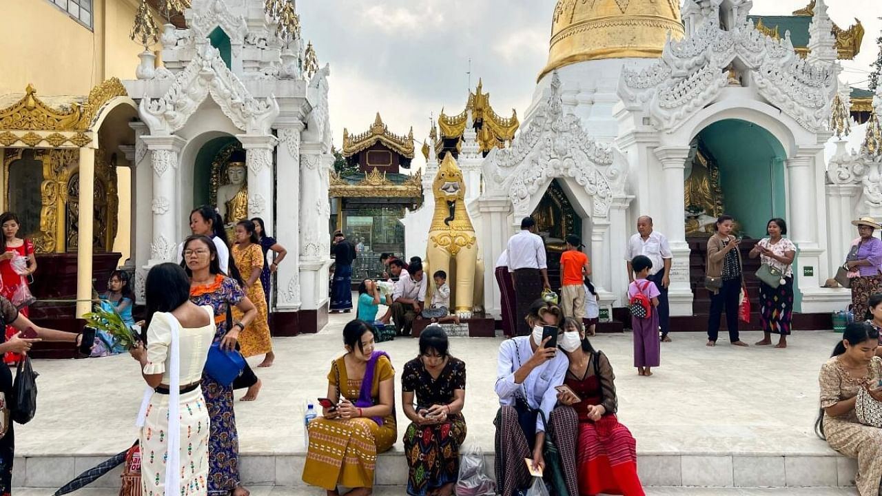 Buddhist devotees visit the Shwedagon pagoda following the Thingyan festival that marks the Burmese New Year in Yangon on April 17, 2023. Credit: AFP Photo