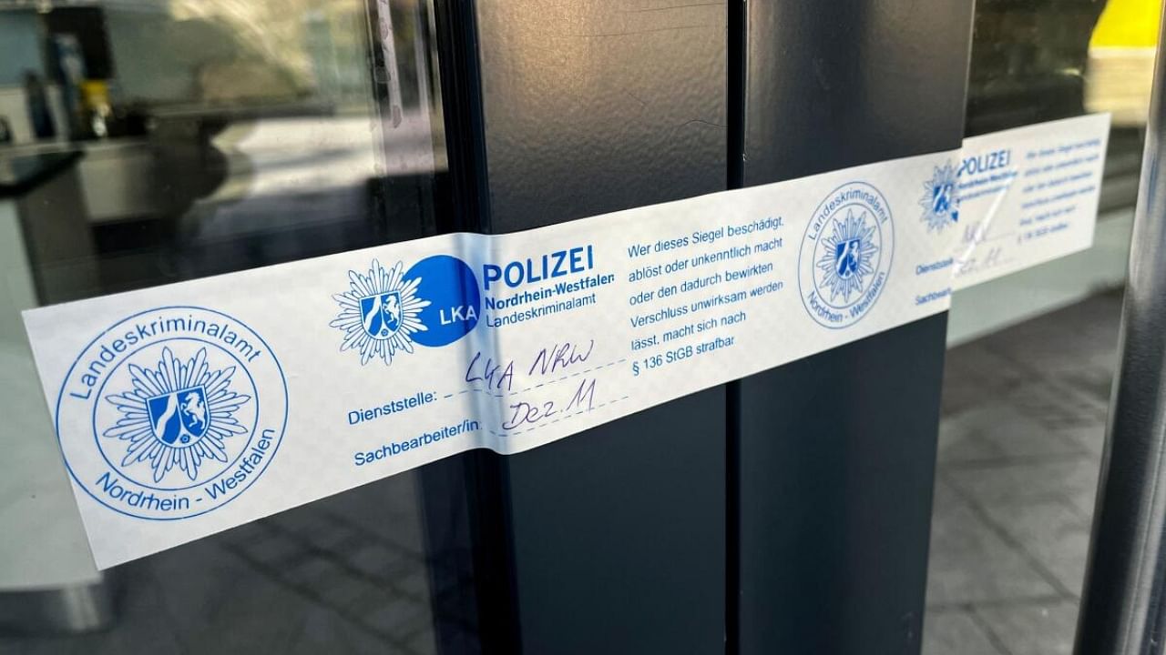 A police seal sticks at a door in Siegen, Germany, May 3, 2023, after German police arrested dozens of people across the country on Wednesday in an investigation of the Italian 'Ndrangheta organised crime group, German public prosecutors and state police said. Credit: Reuters Photo