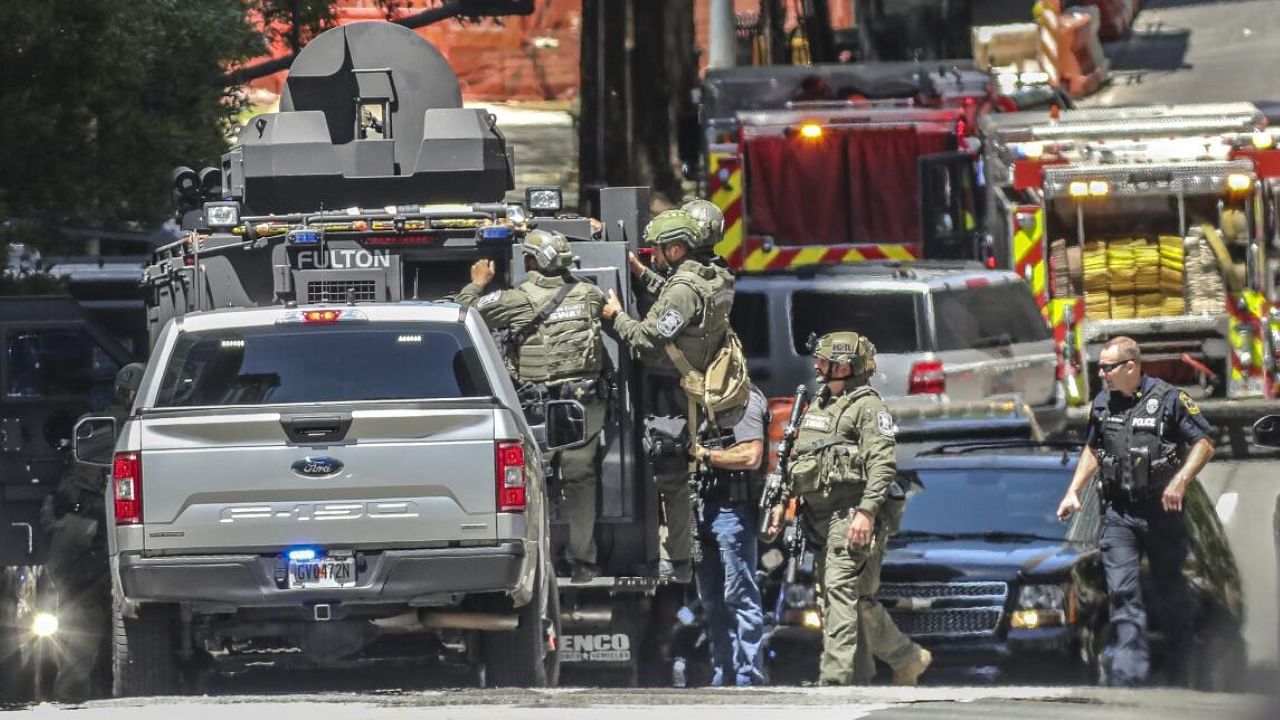 Law enforcement personnel swam in midtown Atlanta, Wednesday, May 3, 2023, where police said a man opened fire inside the waiting room of an Atlanta medical facility, killing one woman and injuring four others. Credit: AP/PTI Photo
