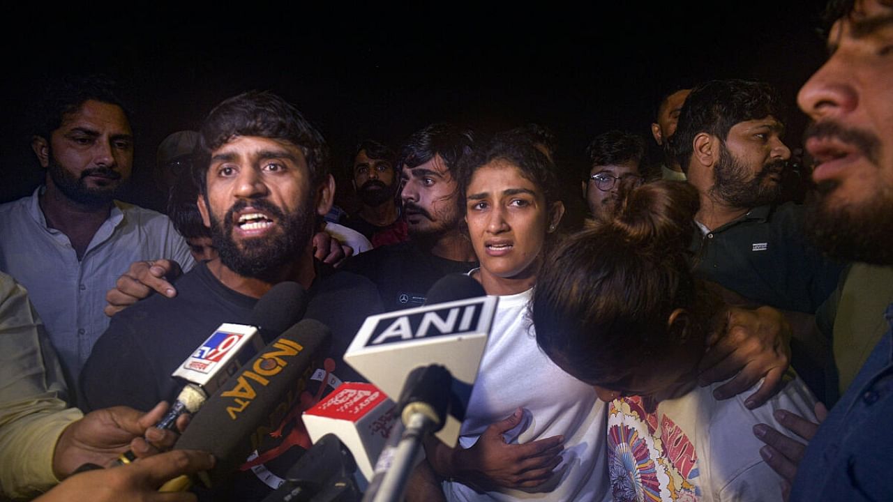 Wrestler Bajrang Punia talks to the media after an scuffle between wrestlers and the police at Jantar Mantar. Credit: PTI Photo