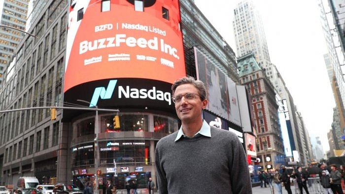 CEO of BuzzFeed Jonah H Peretti poses in front of BuzzFeed screen on Times Square. Credit: AFP Photo
