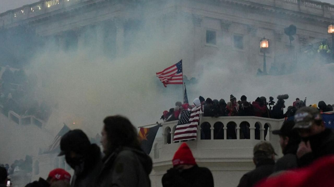 Police clear the US Capitol Building with tear gas as supporters of U.S. President Donald Trump gather outside, in Washington, US January 6, 2021. Credit: Reuters Photo