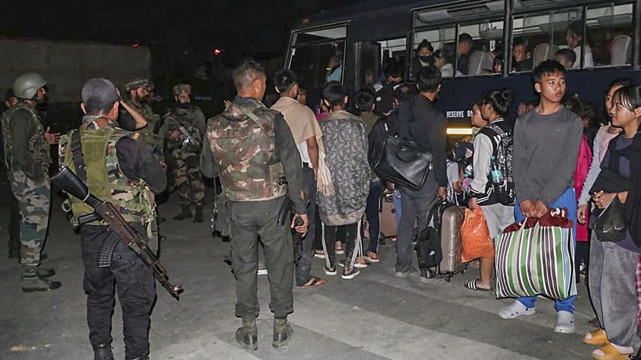  Indian Army and Assam Rifles personnel rescue civilians from violence-hit areas, in Manipur. Credit: PTI Photo