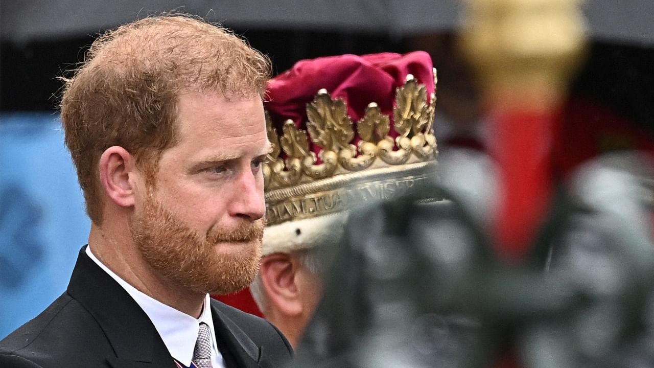 Prince Harry walks outside Westminster Abbey following Britain's King Charles' coronation ceremony. Credit: Reuters Photo