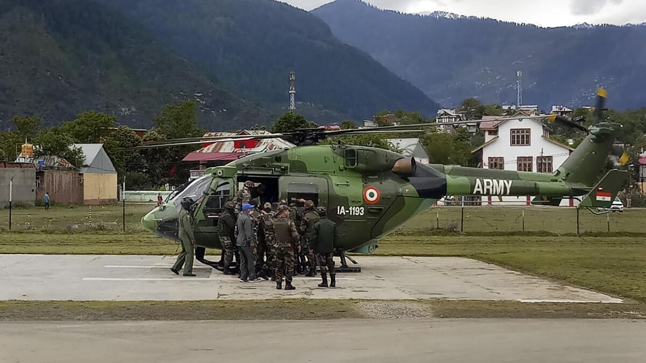  Indian Army personnel launch a rescue operation after an Army helicopter crashed in Jammu and Kashmir's Kishtwar district. Credit: PTI Photo